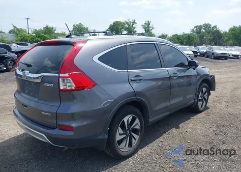 2015 Honda Cr-V Touring z USA, uszkodzony, nr VIN 5J6RM4H97FL125455